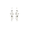 Swanson in pearl earrings