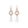 a pair of pearl earrings
