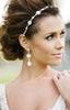 bride with pearl drop earrings and headpiece